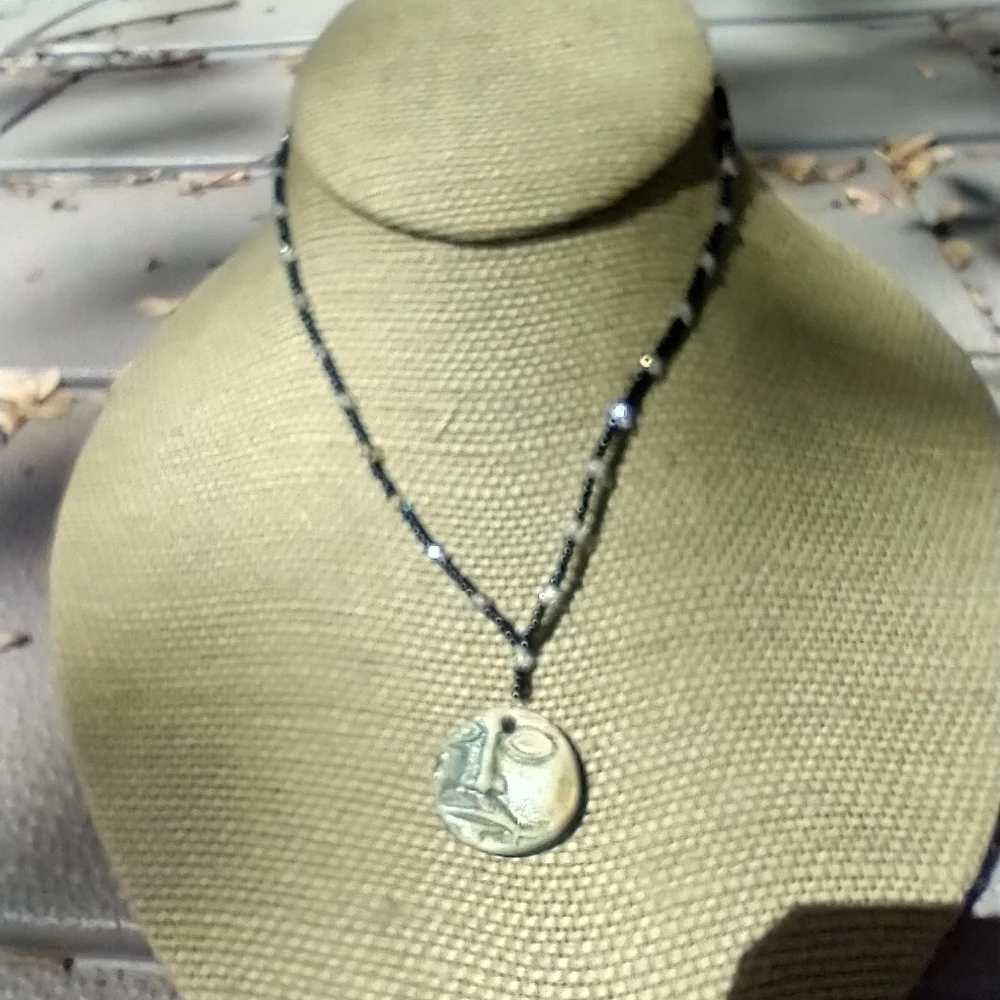 Women's beaded face necklace 14 inches.